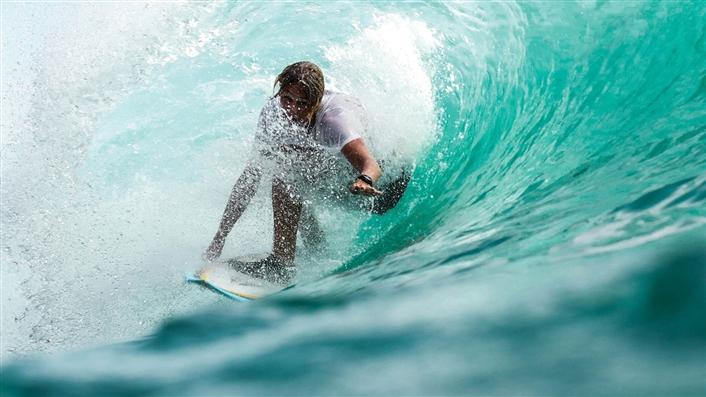 surfer in a tube wave