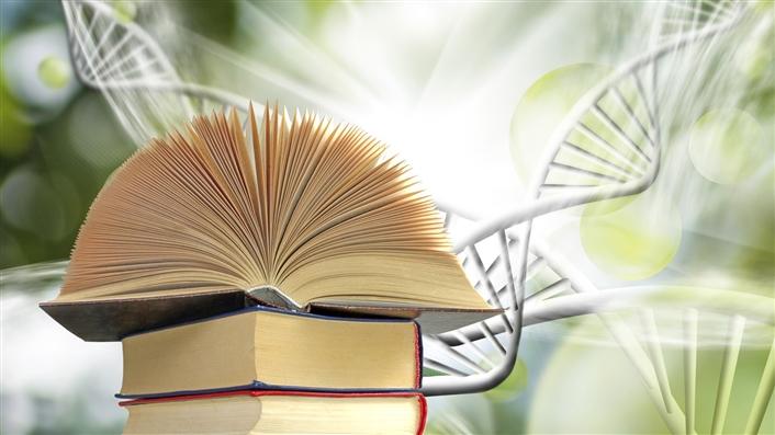 photo of an open book on top of another book with DNA double-helix strands in the background