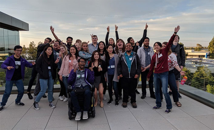 Group photo on an outside patio.