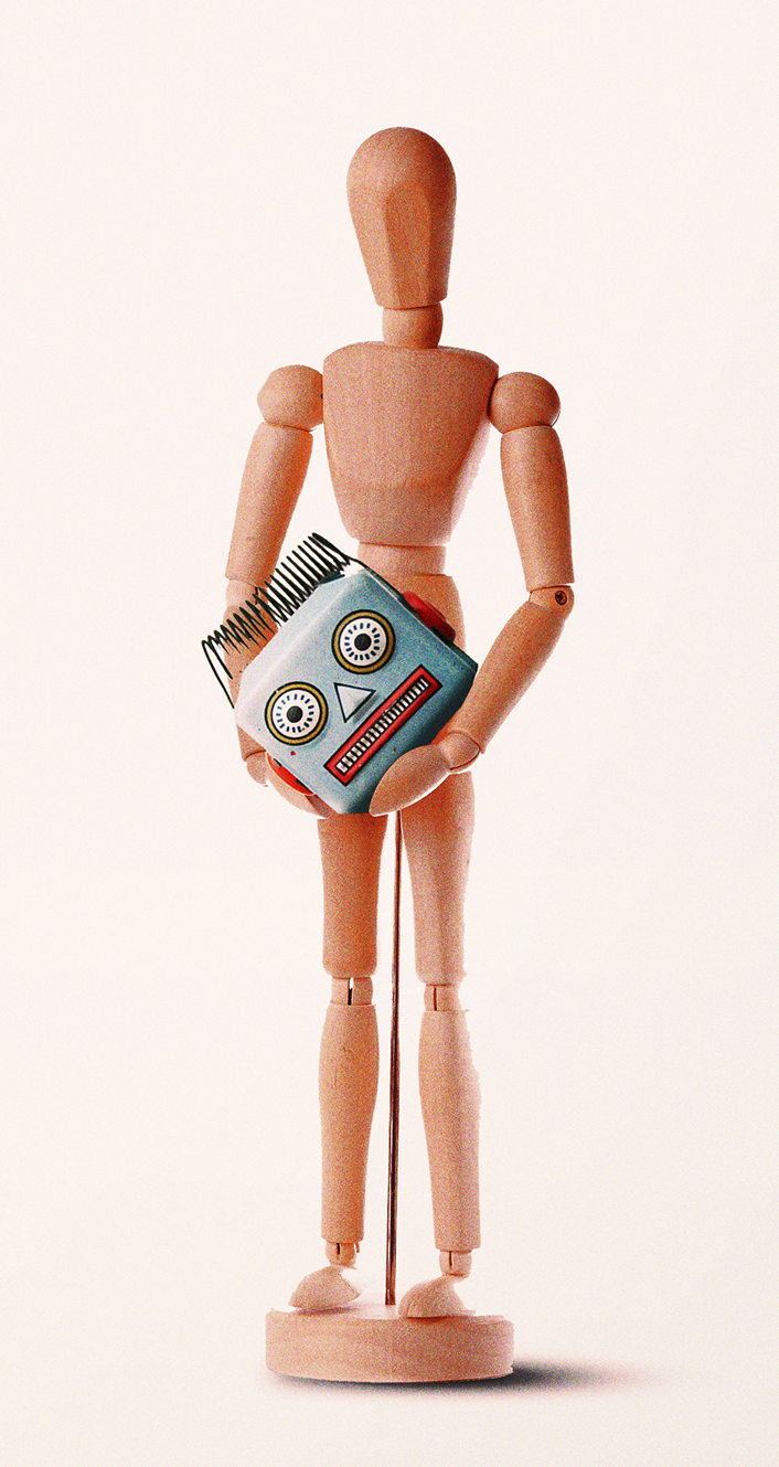 wooden figure holding a robot head