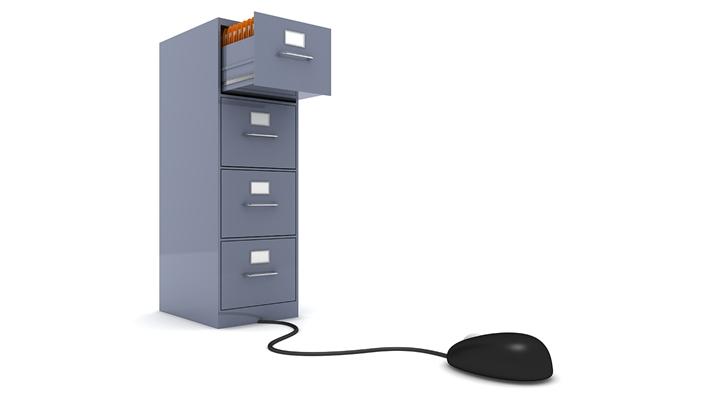 computer mouse attached to a file cabinet