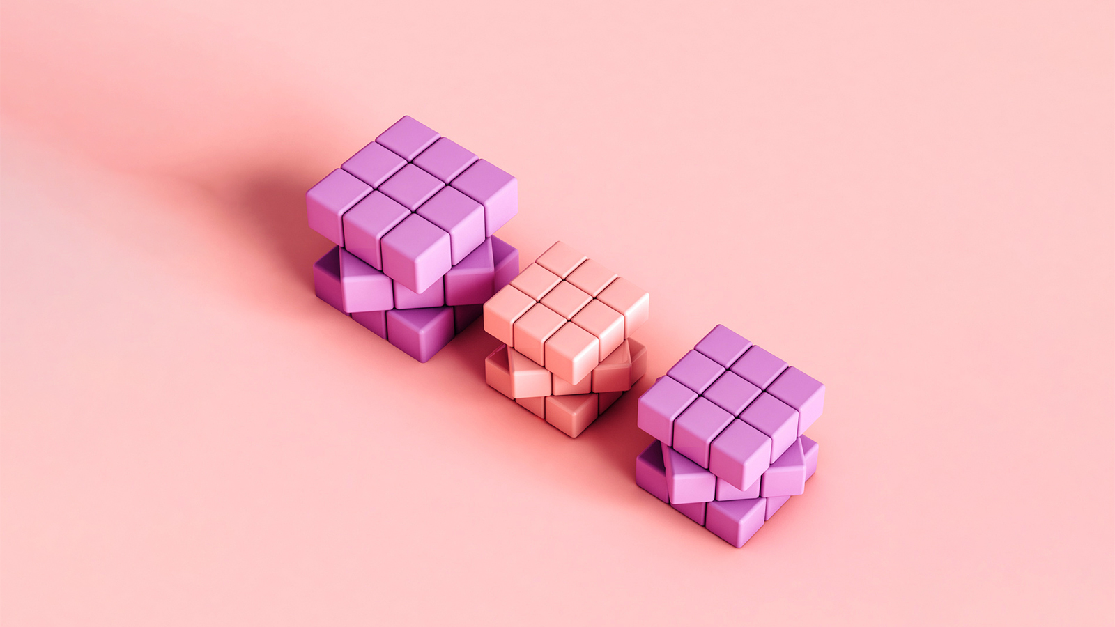 3 pink rubics cubes