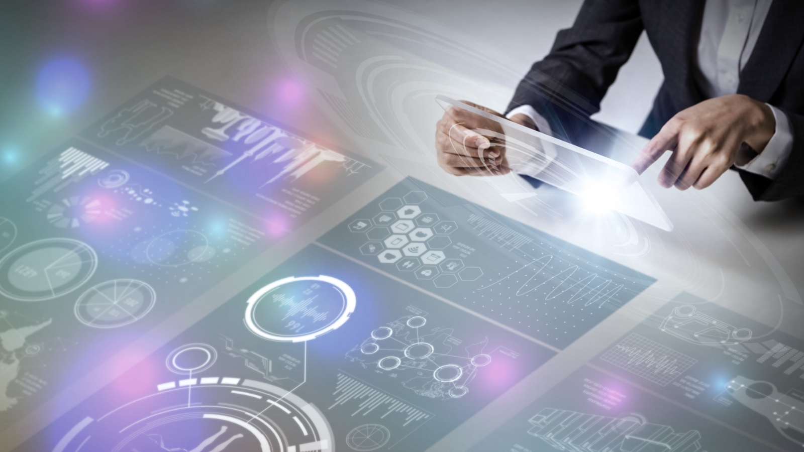 hands maneuvering around a dashboard of graphs