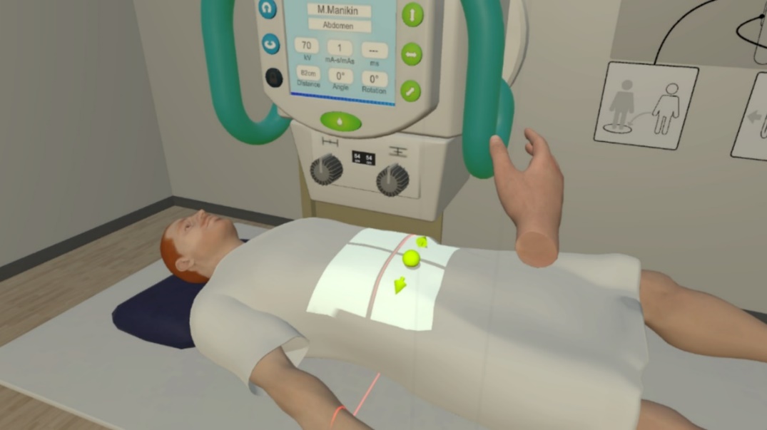Screen shot of the VR application showing a simulated patient in a virtual x-ray machine as the operator of the application positions the x-ray device to take an image.