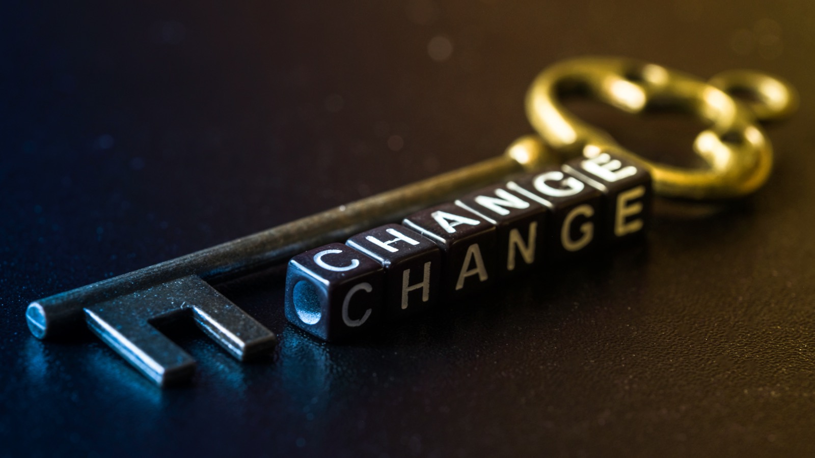 Key with the word 'change' spelled out in blocks next to it