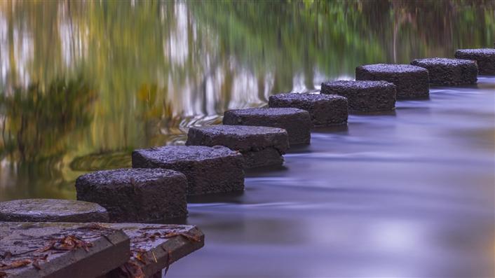 Stepping stones across water.