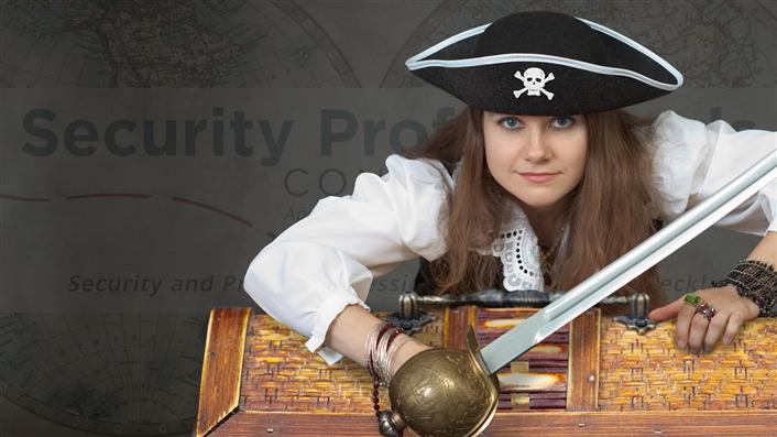 photo of young woman dressed like a pirate holding a sabre and leaning over a treasure chest