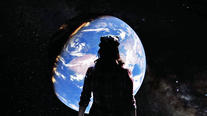 picture of person looking at the earth as if it were way out in space