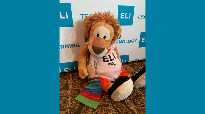 Lion stuffed toy wearing ELI shirt