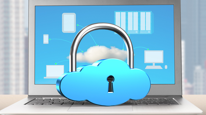 image of a lock in the shape of a cloud sitting on a laptop keyboard