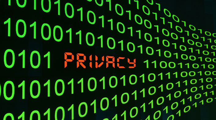 image of rows of green zeros and ones on a black background with the word PRIVACY written into a middle row in red letters