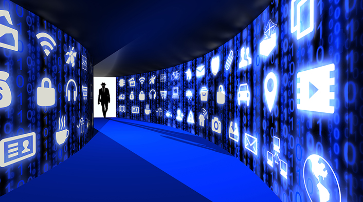 A silhouette of a hacker with a black hat in a suit enters a hallway with walls textured with blue internet of things icons.