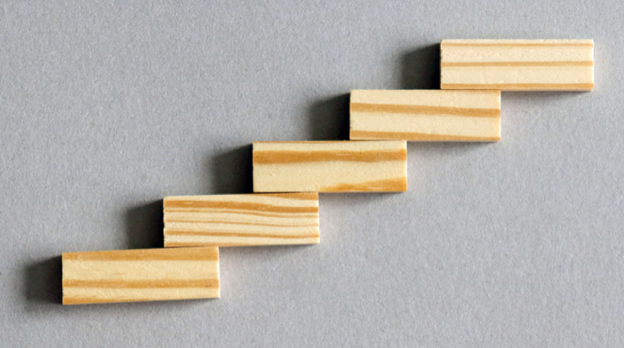 series of offset wooden blocks creating a stairstep-like formation