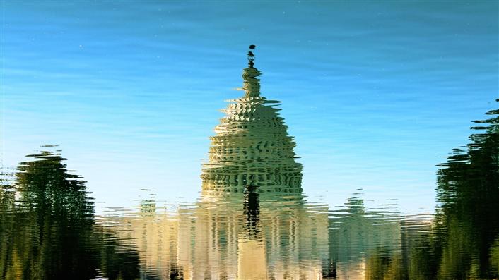 Washington Capitol Building distorted as if seen through heat waves or a rippled reflection in a pool