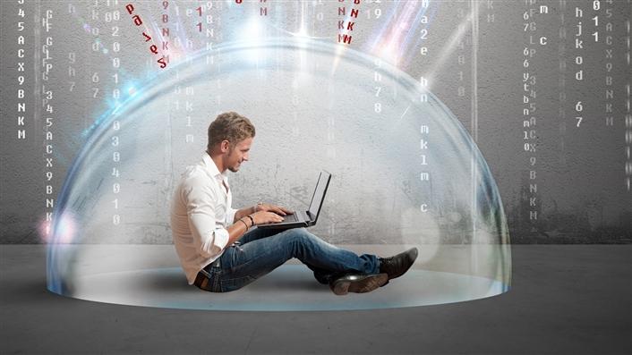 A man sitting under a translucent dome protecting him from data coming towards him