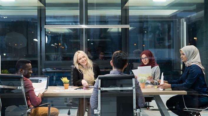 Group of four women in a data center working